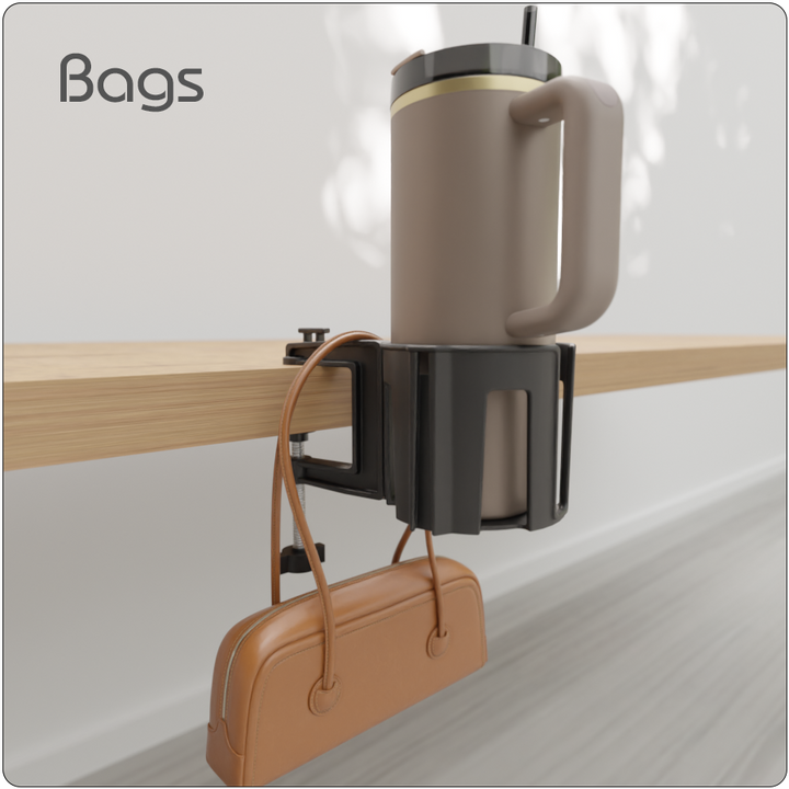 Cup-Holster securing a large mug while a handbag is hung from the hook beneath it on the edge of a desk.